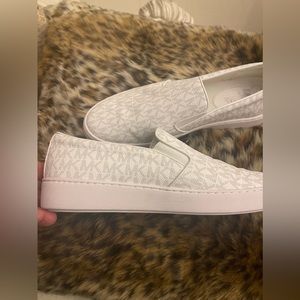 Michael Kors slip on tennis shoes Size 9. Worn once.